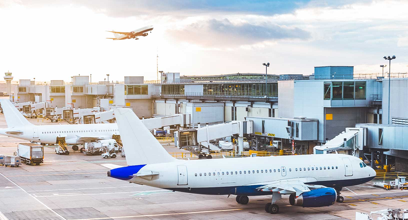 Busy airport departure terminal and tarmac